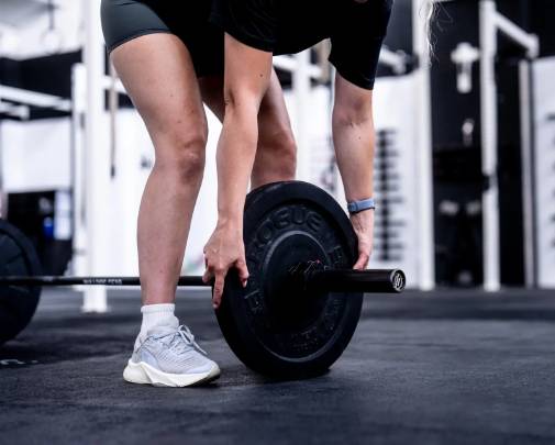 Woman training with barbell